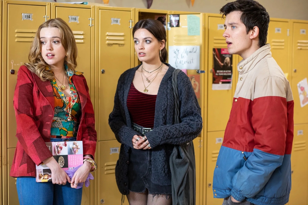 three characters from Sex Education standing by lockers
